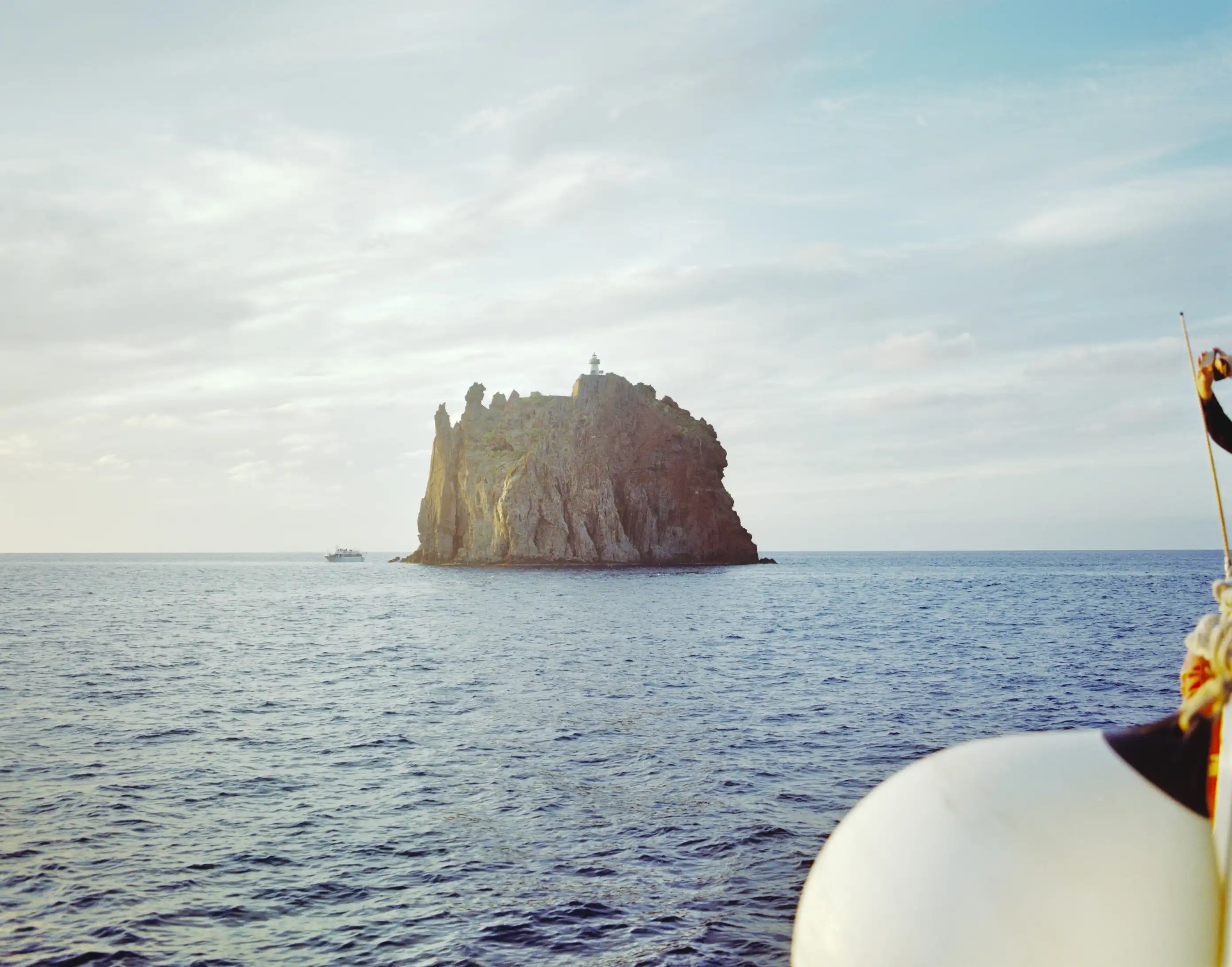 A giant rock in the middle of the sea.